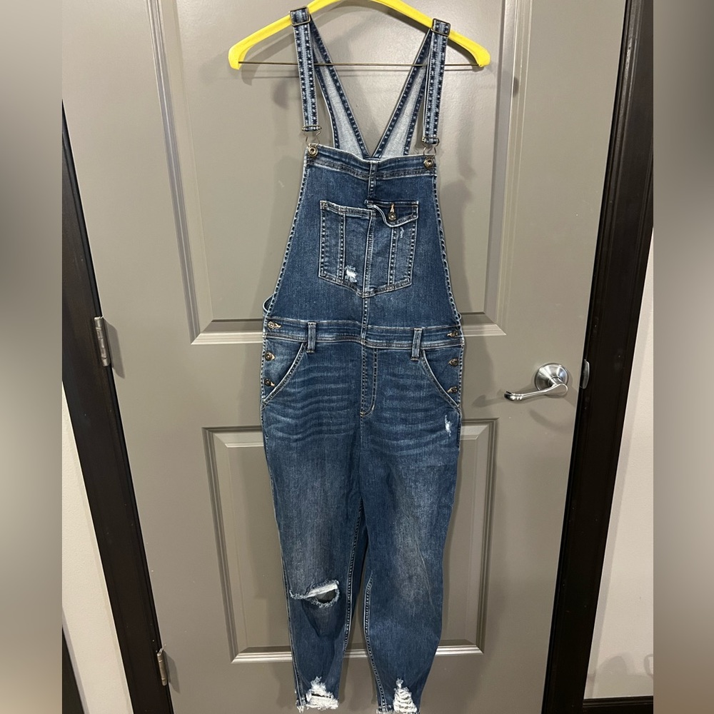 Womens distressed jean overalls.